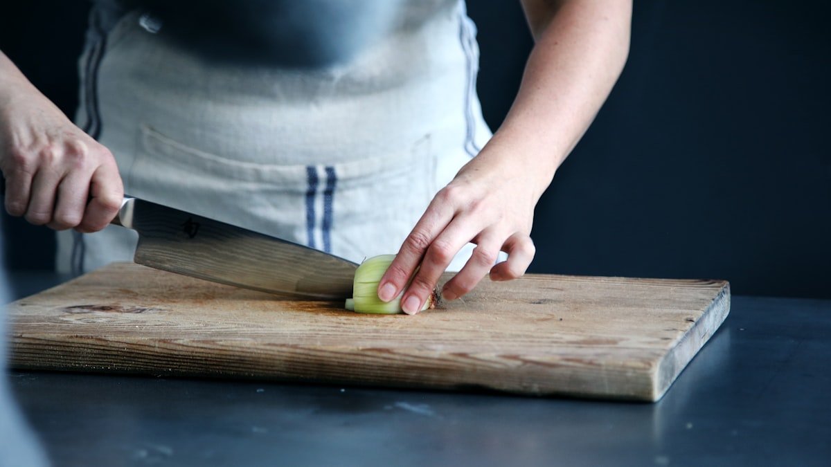 Cutting board with fresh vegetables being prepared
